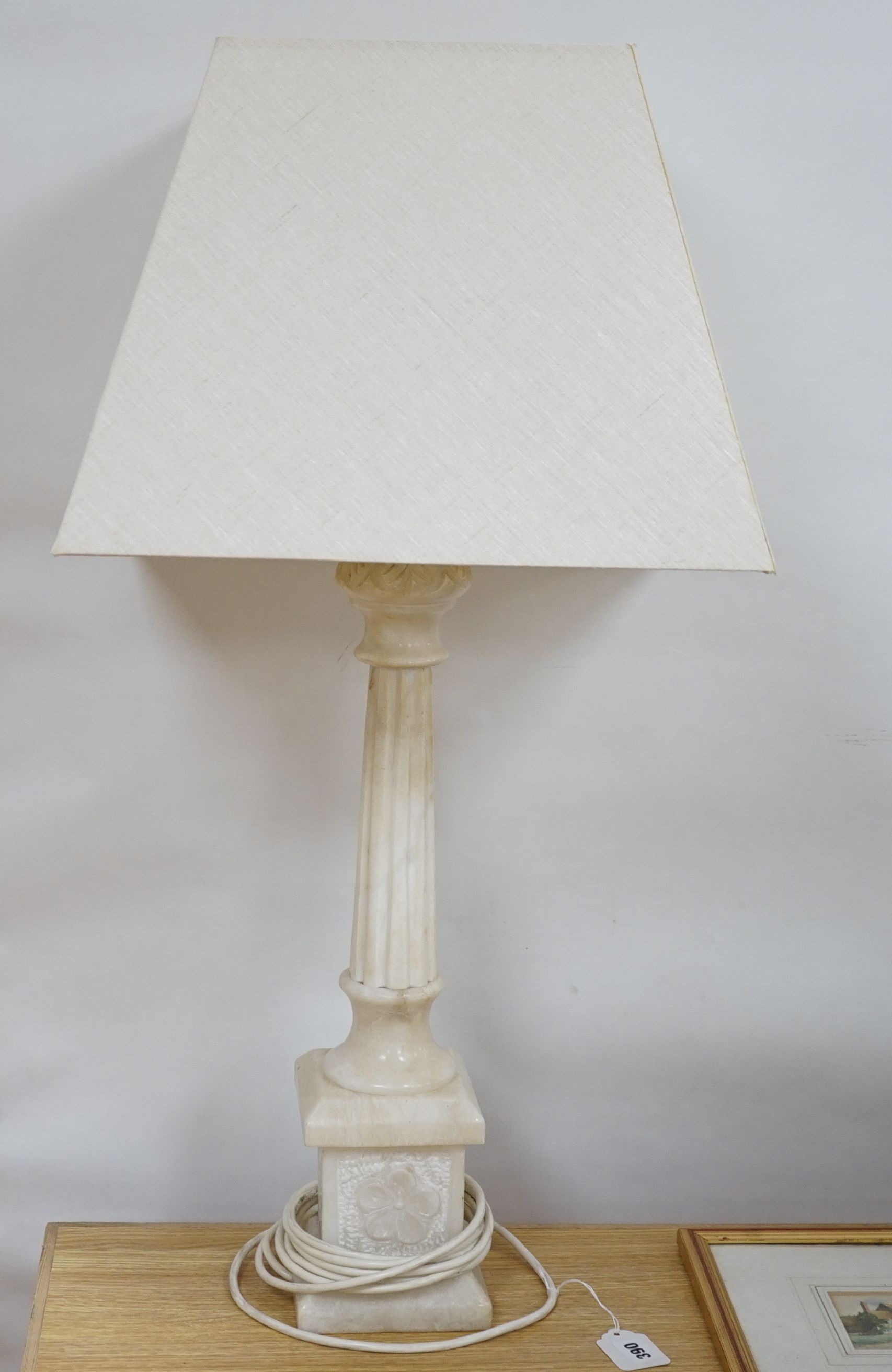 An alabaster desk lamp with shade